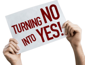 Person holding a sign that reads "Turning No into Yes!" Featured image for "Influencing Decision Makers Effectively."